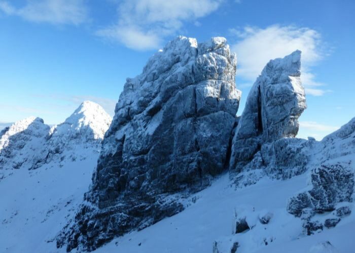 The Basteir Tooth and Am Basteir. Hung Drawn and Quartered takes the multi-tiered straight fault. It is one of our most prized and hardest winter climbs at grade VIII, 8 - Skye Guides